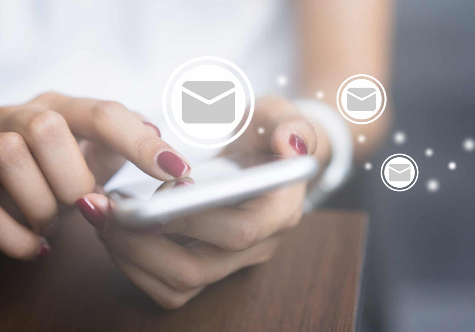 close up woman holding smartphone and checking email online on web with virtual interface technology concept